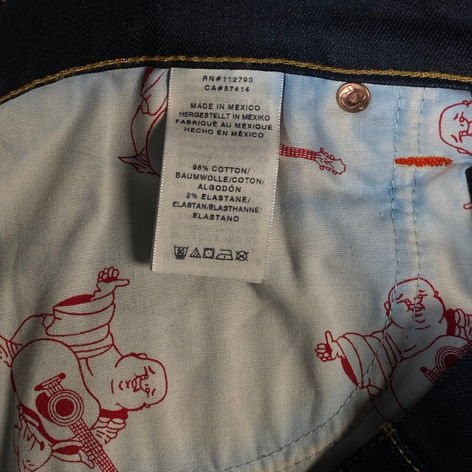 Digg It Thrift & Vintage True Religion denim jorts interior care label showing 98 percent cotton and 2 percent elastane