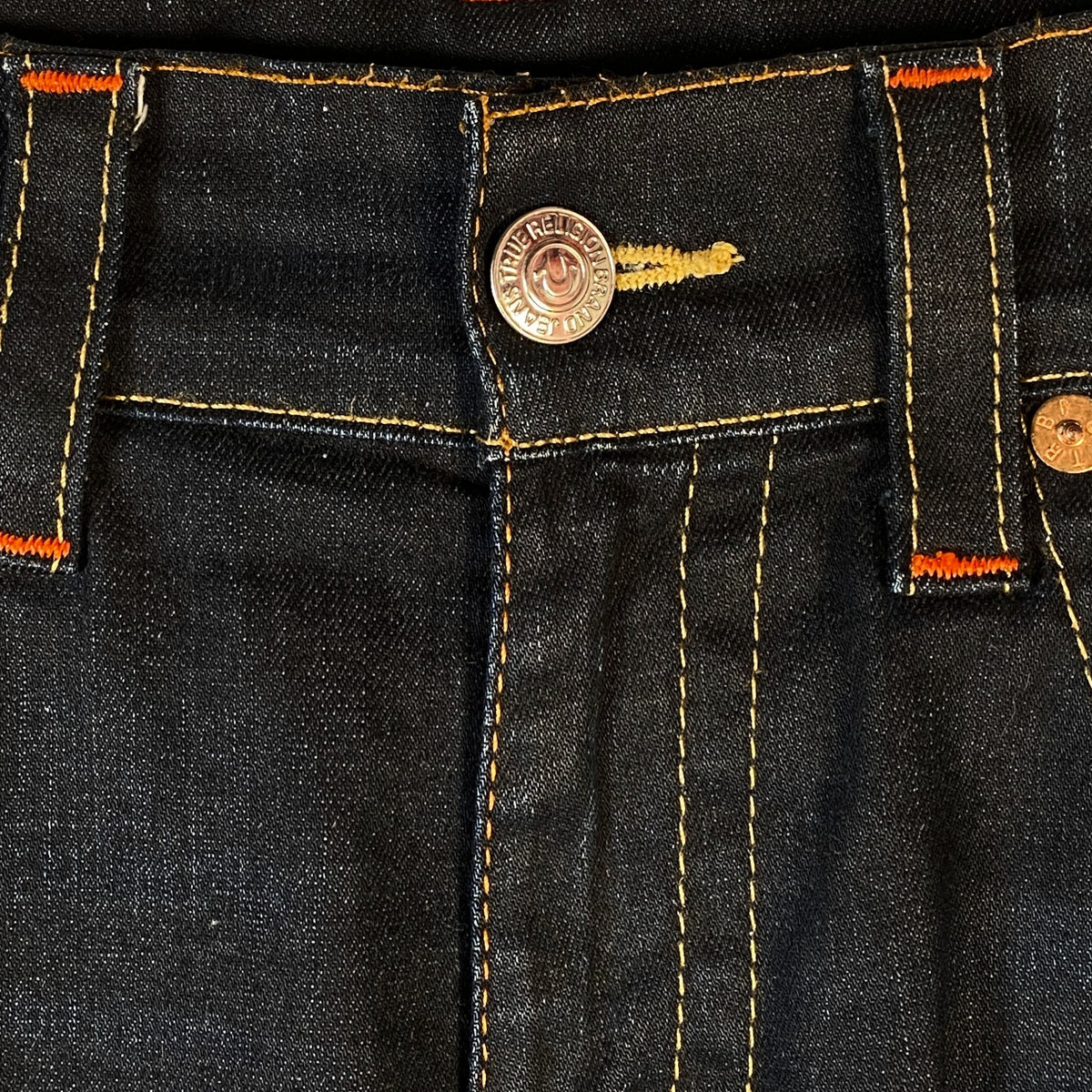 Digg It Thrift & Vintage True Religion dark wash denim jorts featuring signature orange contrast stitching and button