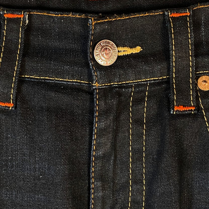 Digg It Thrift & Vintage True Religion dark wash denim jorts featuring signature orange contrast stitching and button