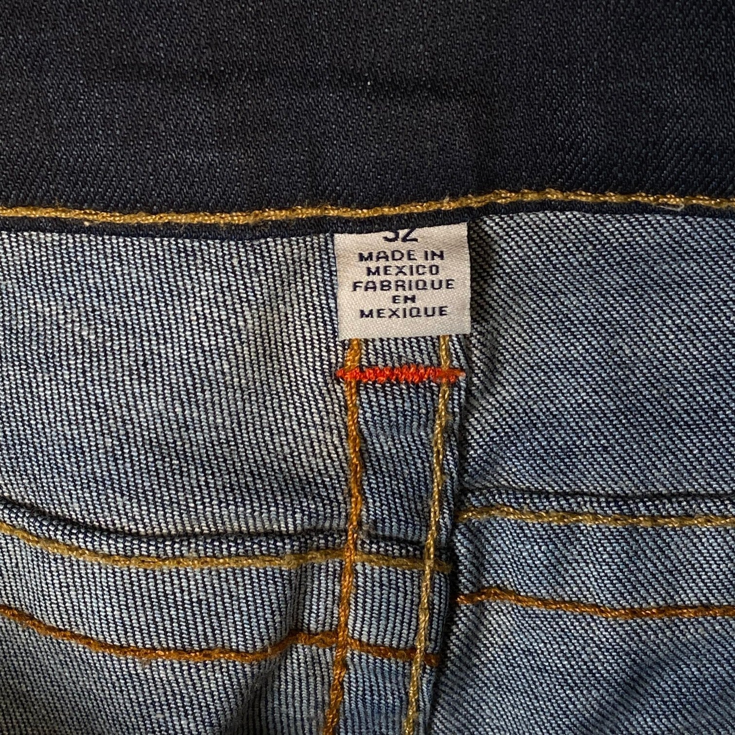 Digg It Thrift & Vintage True Religion dark wash denim jorts size 32 tag with orange contrast stitching
