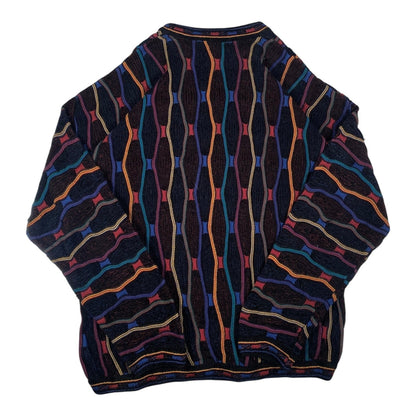 Digg It Thrift & Vintage Tundra Canada crewneck sweater featuring a multi-colored vertical cable knit pattern.