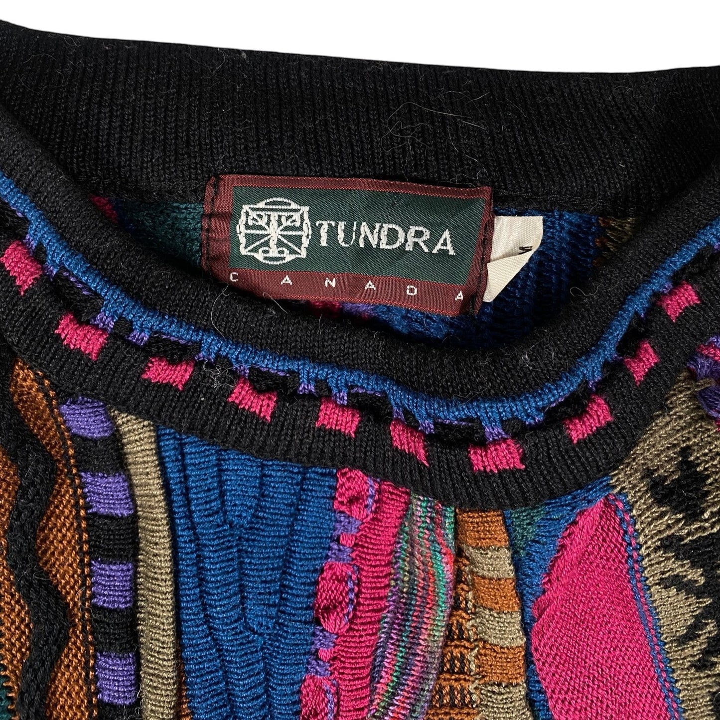 Digg It Thrift & Vintage Tundra Canada sweater featuring a vibrant abstract multi-pattern textured knit and black collar