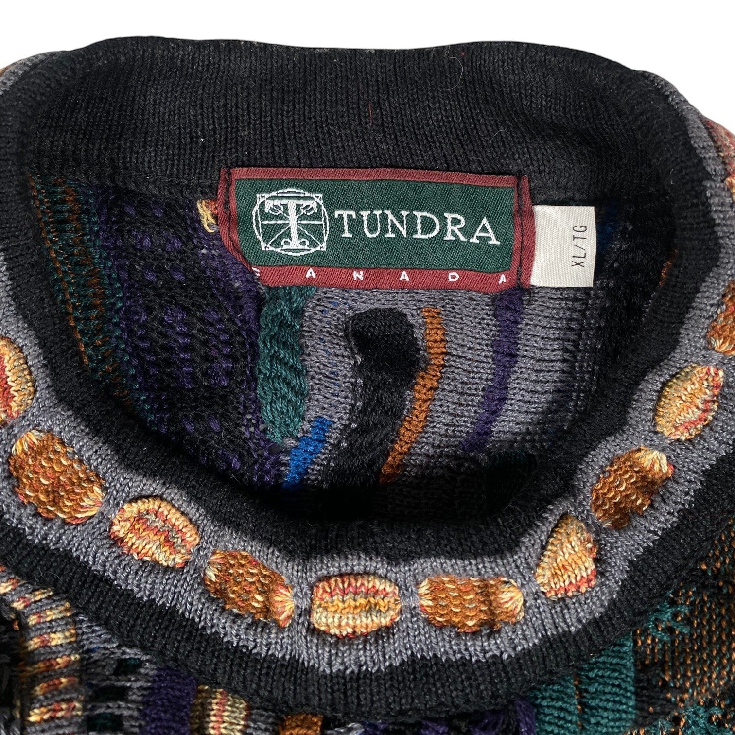 Digg It Thrift & Vintage Tundra Canada multi-pattern knit crewneck sweater with black collar and textured details