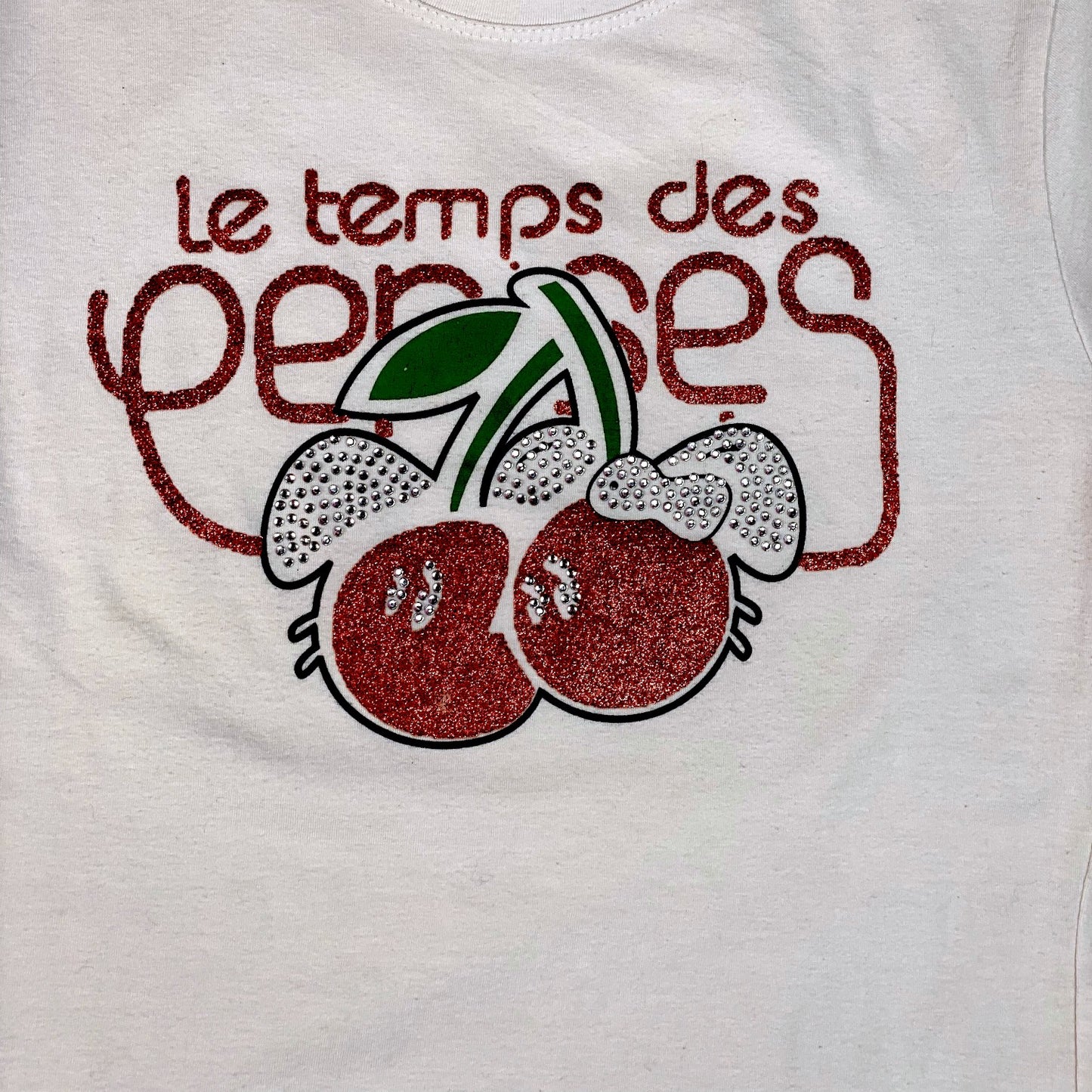 Digg It Thrift & Vintage white t-shirt featuring a red glitter cherry graphic with rhinestone accents