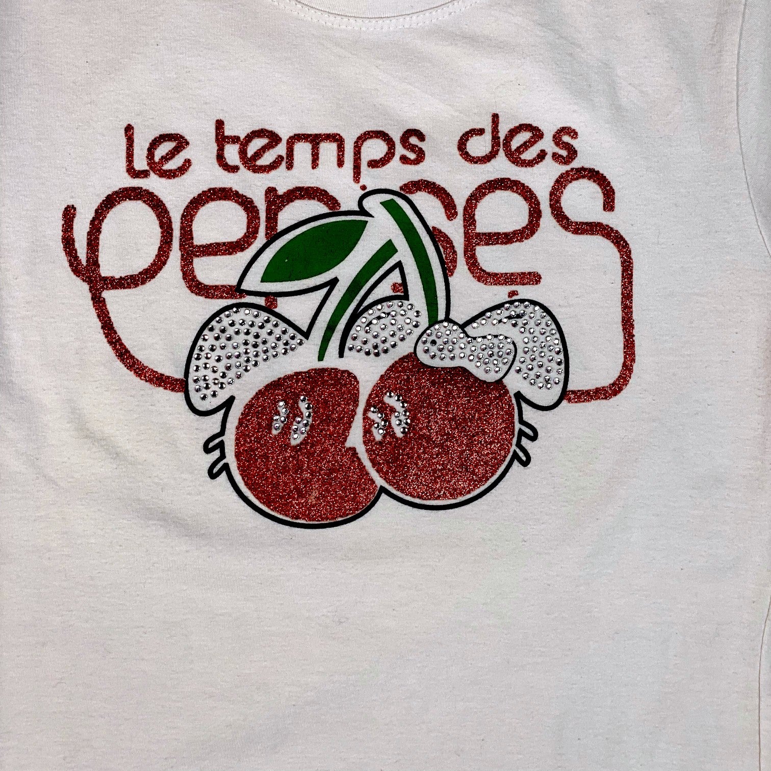 Digg It Thrift & Vintage white t-shirt featuring a red glitter cherry graphic with rhinestone accents