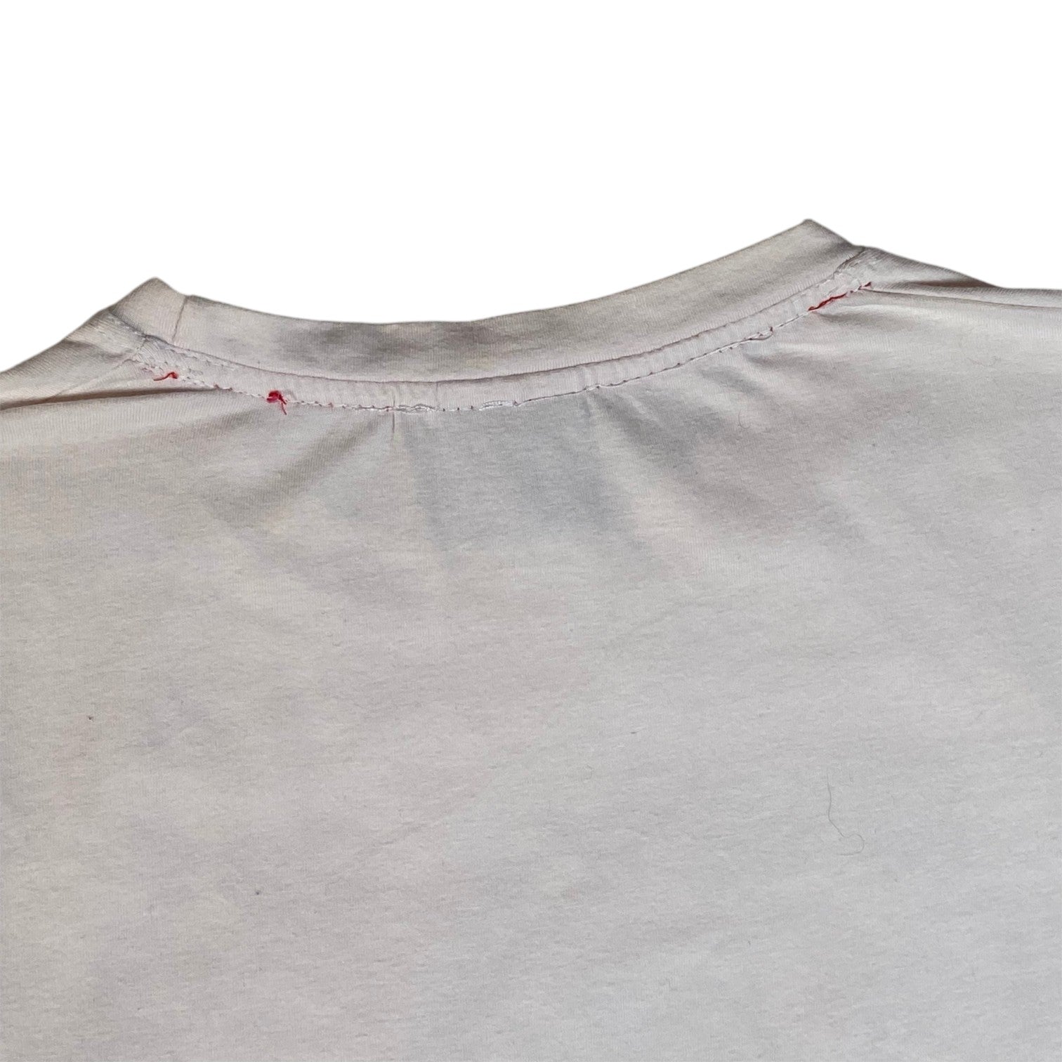 Digg It Thrift & Vintage white Le Temps des Cerises t-shirt featuring red stitching detail at the neckline.