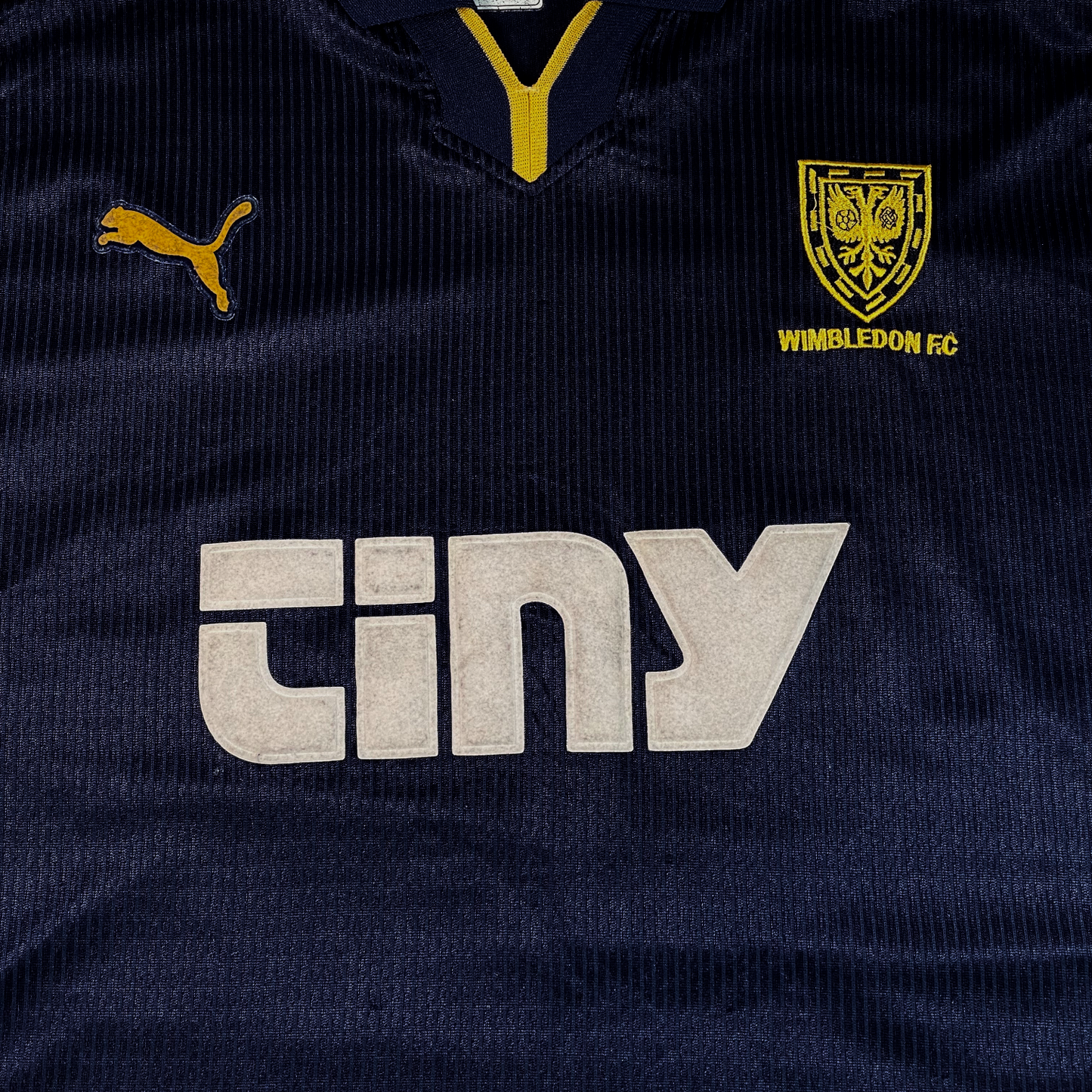 Digg It Thrift & Vintage 1999-2000 Wimbledon FC home football shirt in navy blue with yellow accents and sponsor logo