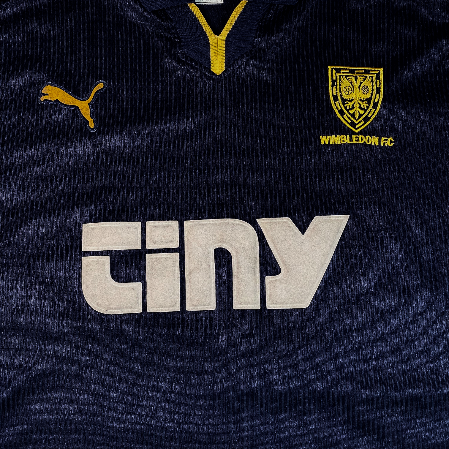 Digg It Thrift & Vintage 1999-2000 Wimbledon FC home football shirt in navy blue with yellow accents and sponsor logo