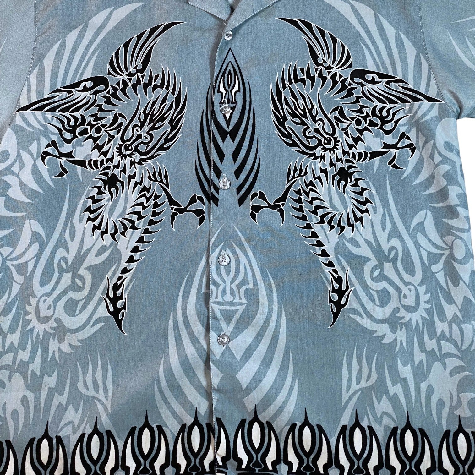 Digg It Thrift & Vintage Y2K button-up shirt in light blue featuring black tribal dragon and East Asian motifs.
